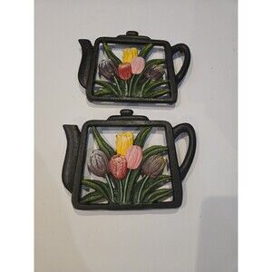 two decorative cast iron trivets Tea Kettle With Tulips